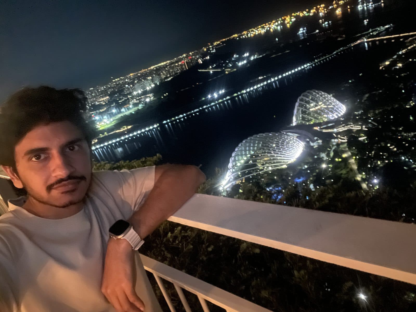 Balcony selfie over night valley lights