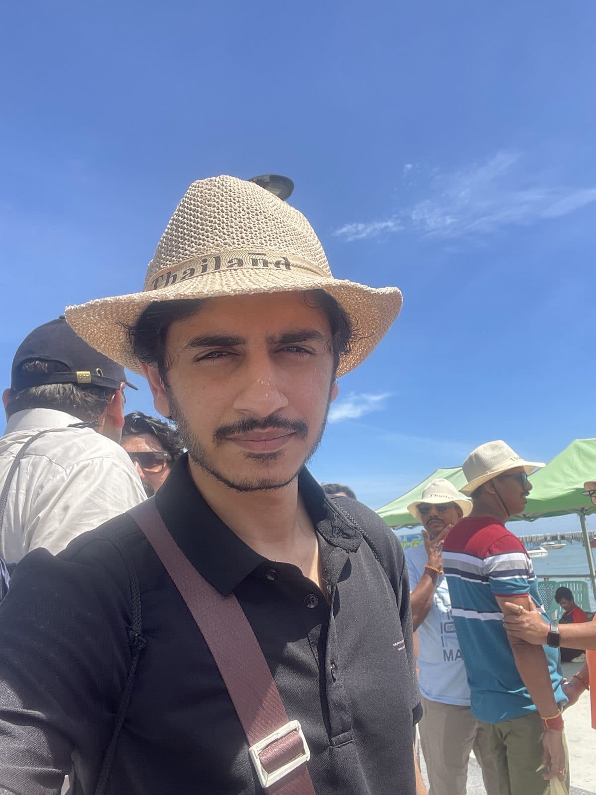 Pier selfie in a straw hat in Thailand