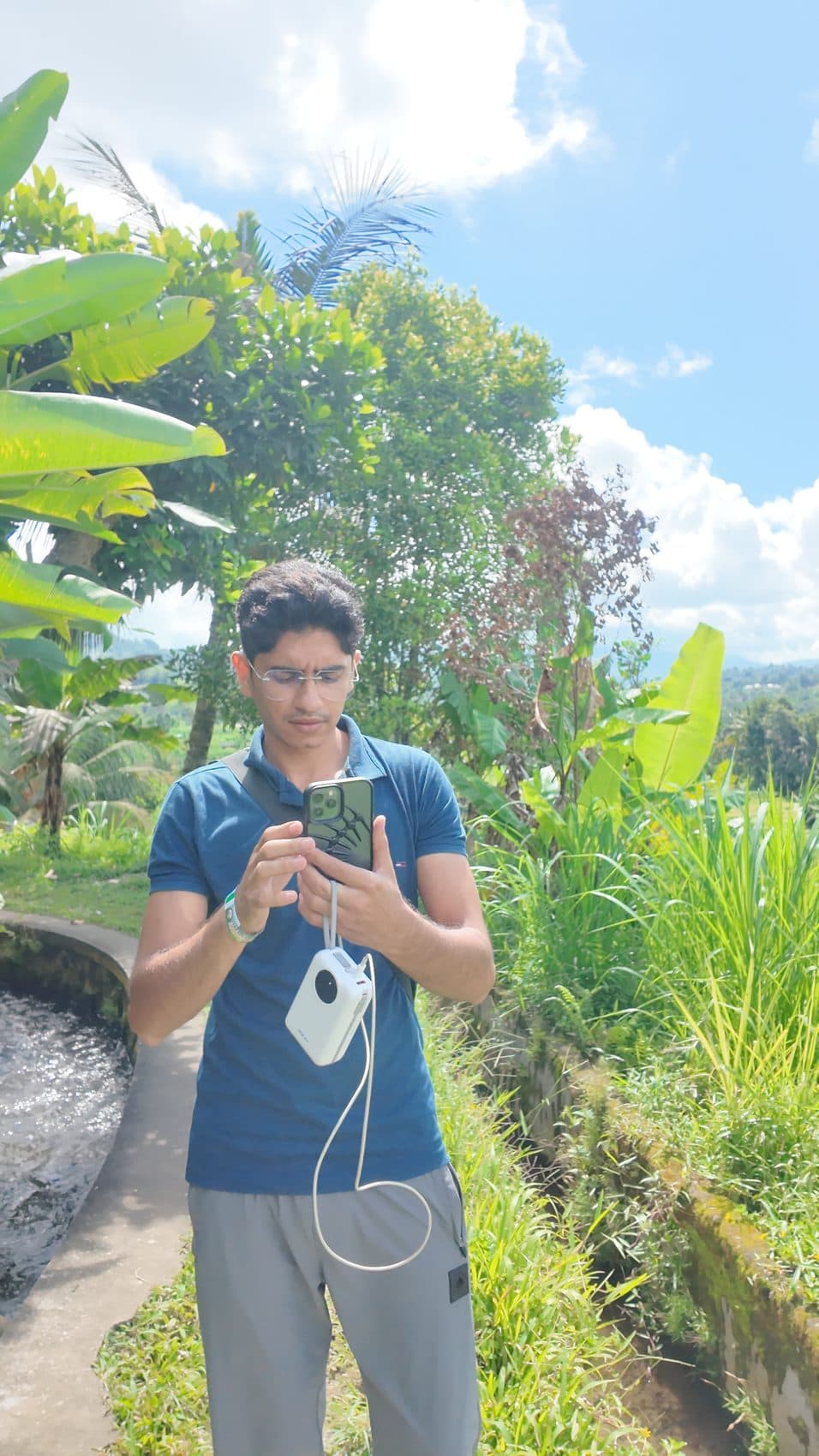 Working from a rice terrace, phone and power bank — nomad operator